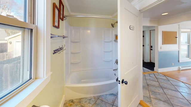 bathroom with a wealth of natural light, crown molding, and a baseboard radiator