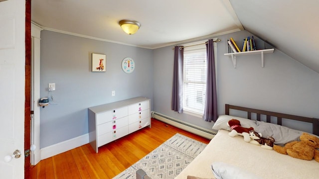 bedroom with wood-type flooring, vaulted ceiling, and a baseboard heating unit