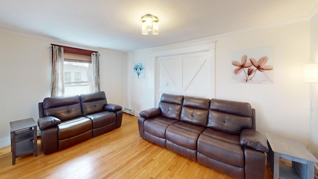 living room featuring light hardwood / wood-style flooring, baseboard heating, and ornamental molding