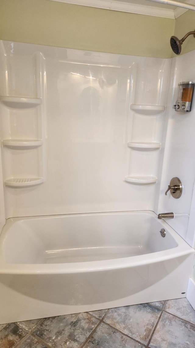 bathroom featuring tile patterned floors and washtub / shower combination