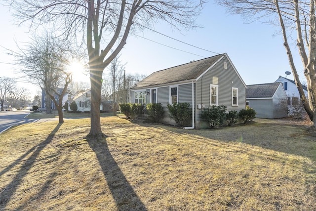 view of home's exterior featuring a yard