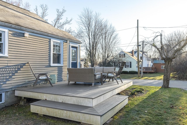 wooden deck featuring a yard and an outdoor hangout area