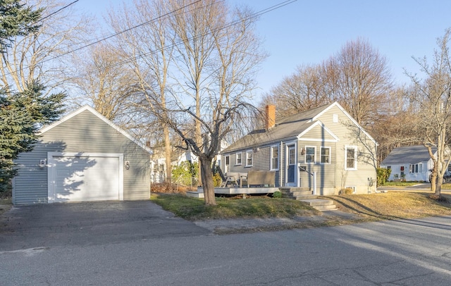 view of front of property featuring an outbuilding and a garage