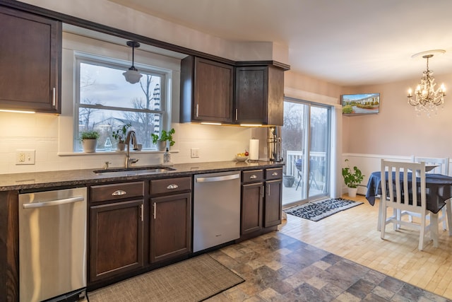 kitchen with dishwasher, dark brown cabinetry, decorative light fixtures, and sink