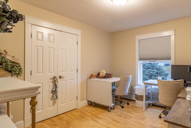 office area with light hardwood / wood-style floors