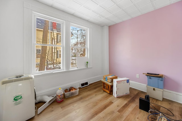 miscellaneous room with hardwood / wood-style floors