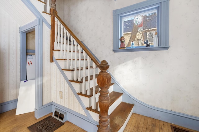 stairs with wood-type flooring