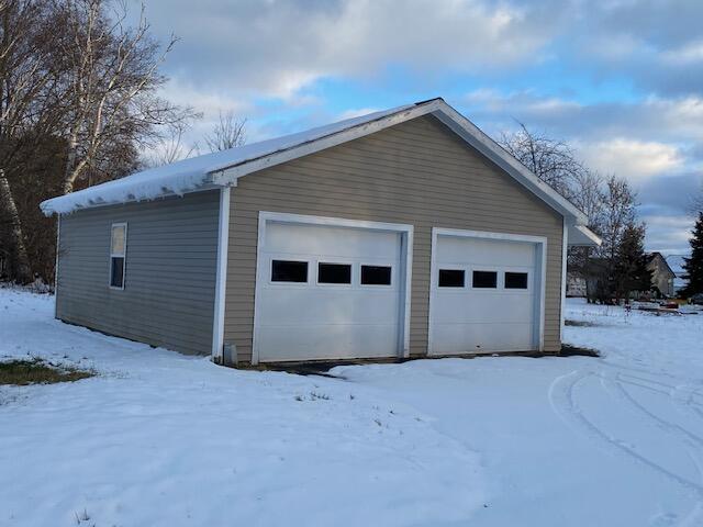 view of snow covered garage