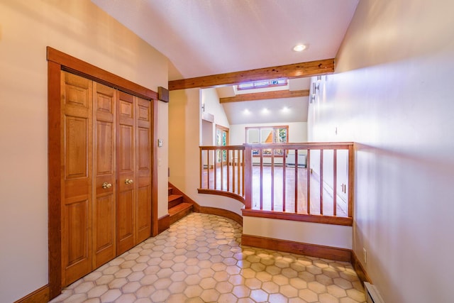 corridor featuring vaulted ceiling with beams and a baseboard heating unit