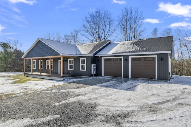 ranch-style house featuring a porch and a garage