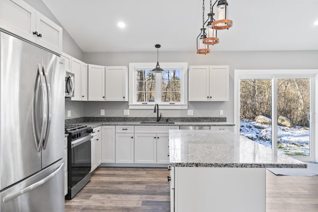 kitchen featuring sink, white cabinets, and appliances with stainless steel finishes