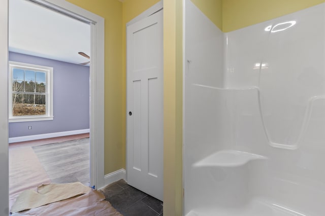 bathroom with tile patterned floors and walk in shower