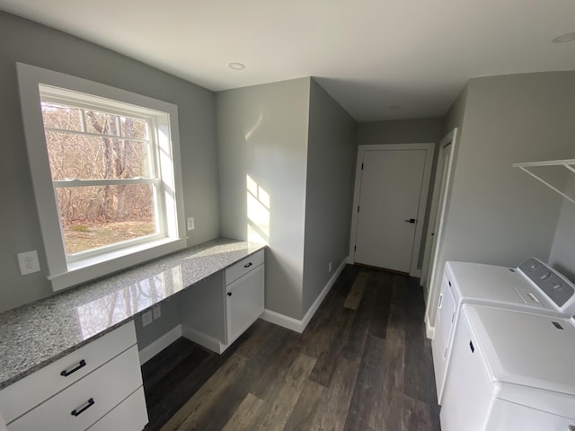 laundry area with washer and dryer and dark hardwood / wood-style flooring