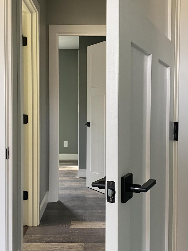 hall with dark wood-type flooring