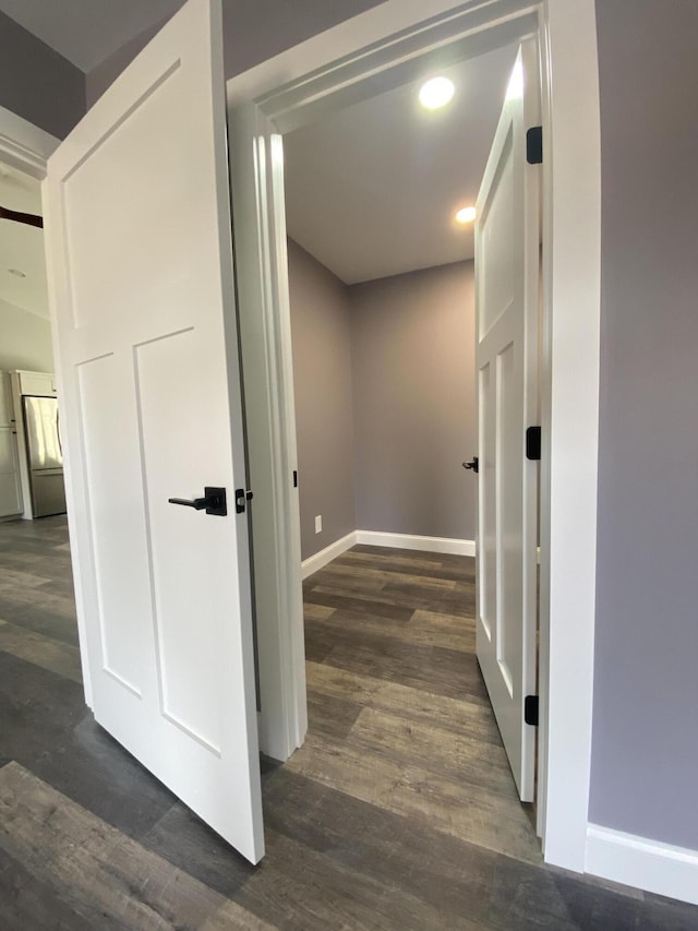 hallway featuring dark wood-type flooring