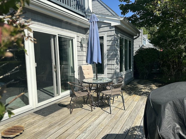 wooden terrace with area for grilling