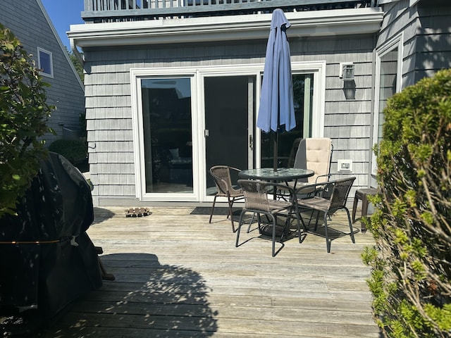 wooden terrace featuring grilling area