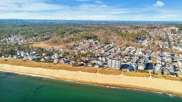 aerial view with a water view and a beach view