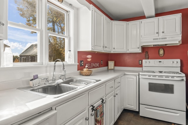 kitchen featuring white electric range oven, white cabinets, light countertops, under cabinet range hood, and a sink