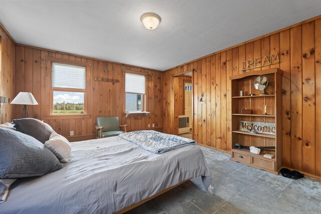 bedroom featuring wooden walls