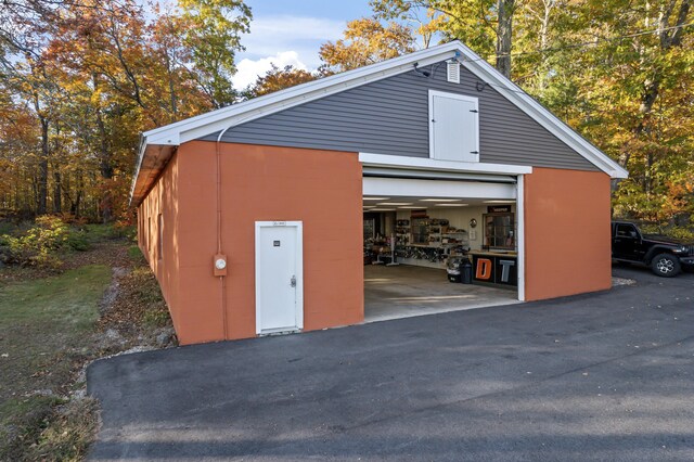 detached garage featuring driveway