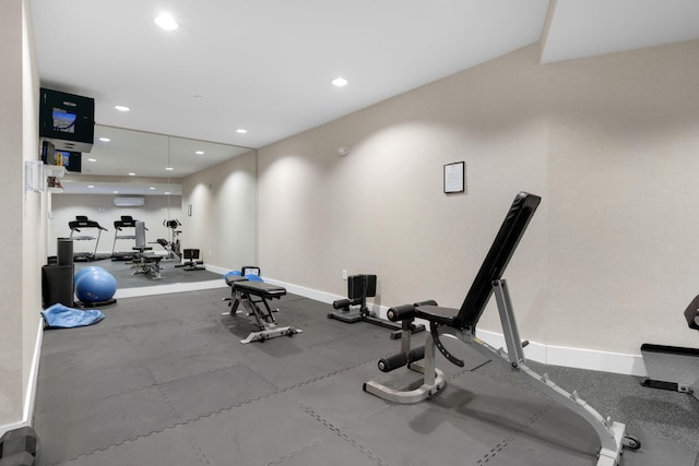 workout area featuring an AC wall unit