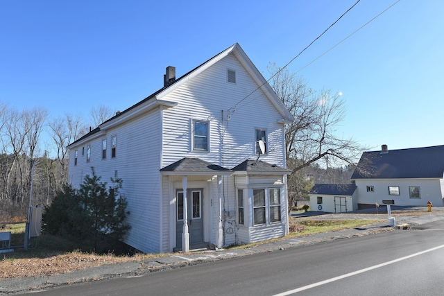 front of property featuring an outbuilding