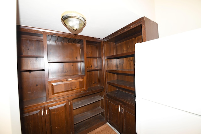 spacious closet with light hardwood / wood-style floors