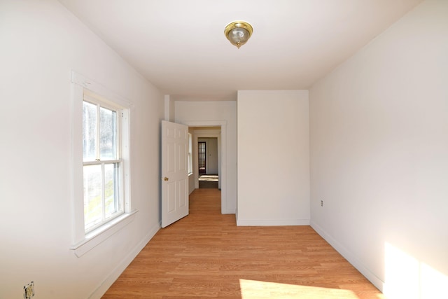 unfurnished room with light hardwood / wood-style flooring