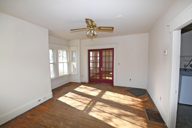 unfurnished room with french doors, washer / clothes dryer, dark hardwood / wood-style floors, and ceiling fan