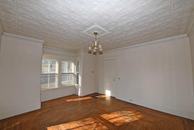 unfurnished room with a chandelier, dark parquet flooring, a textured ceiling, and crown molding