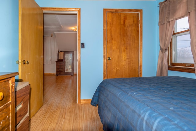 bedroom featuring light hardwood / wood-style floors and a closet