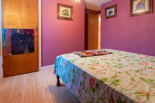 bedroom with hardwood / wood-style floors