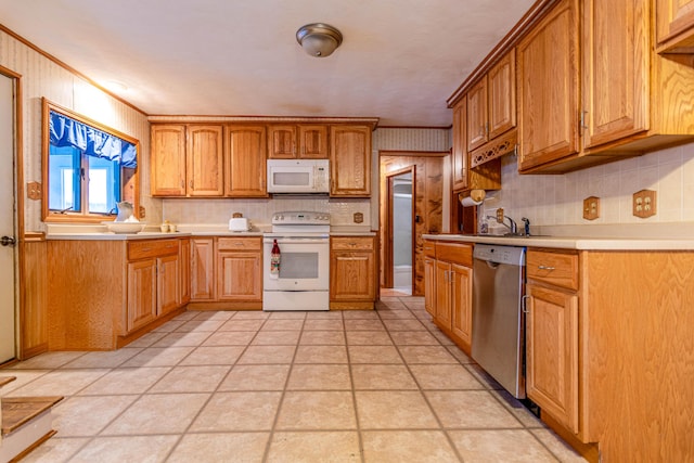 kitchen featuring backsplash, white appliances, crown molding, and wooden walls