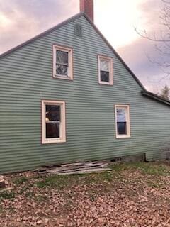 view of property exterior at dusk