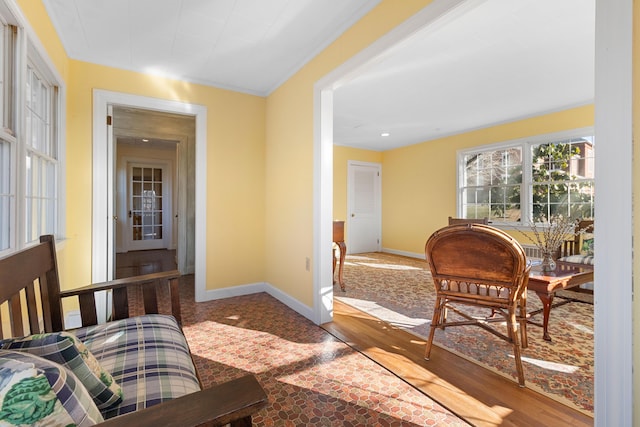 interior space with crown molding and wood-type flooring