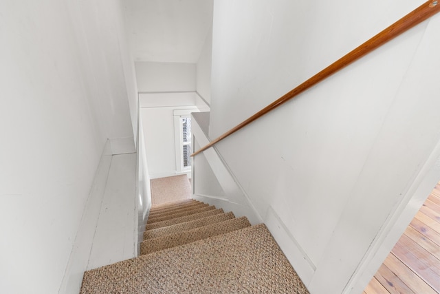 stairway featuring hardwood / wood-style flooring