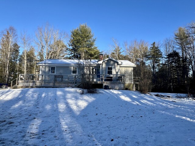 view of front of home featuring a wooden deck