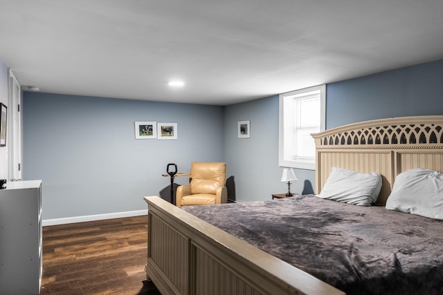 bedroom featuring dark hardwood / wood-style flooring