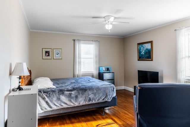 bedroom with ceiling fan, hardwood / wood-style floors, and crown molding