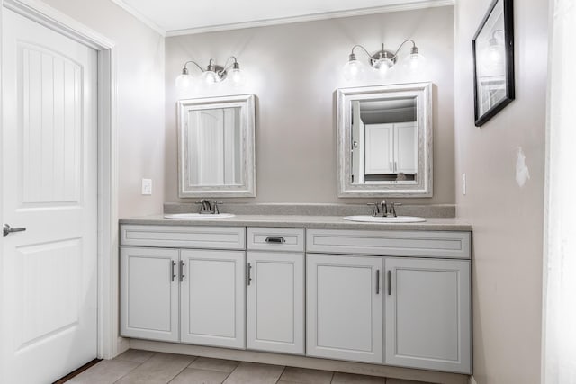 bathroom featuring crown molding, tile patterned flooring, and vanity