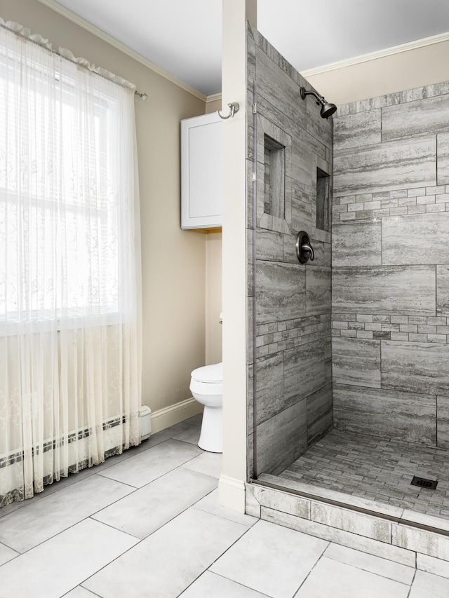 bathroom featuring tile patterned flooring, a baseboard heating unit, toilet, and crown molding