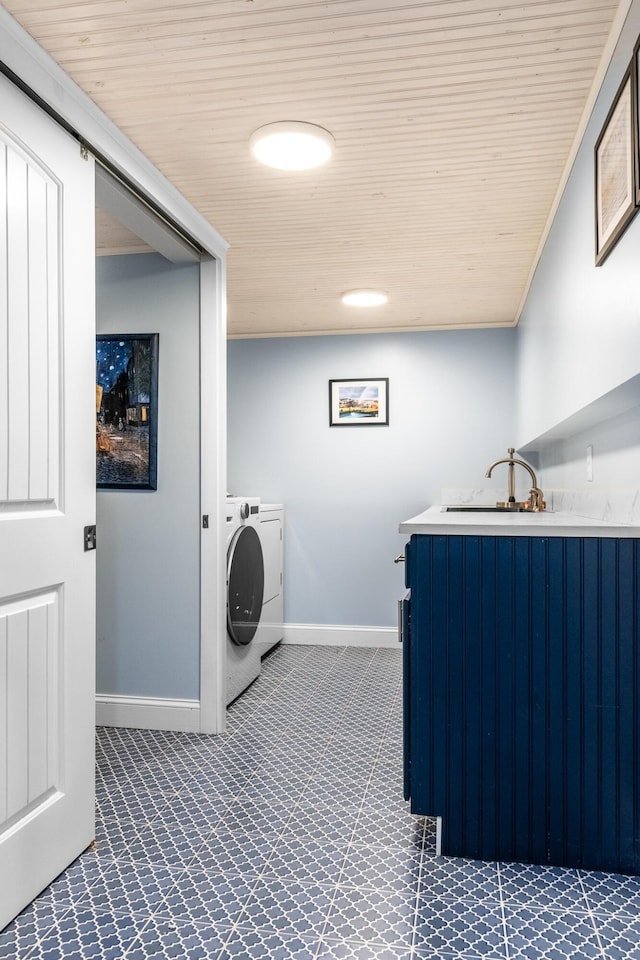 clothes washing area featuring sink