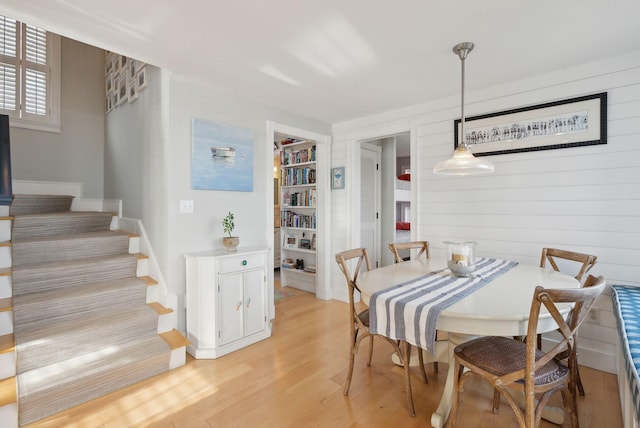 6 Brooks St, Kennebunkport, ME 04046 - dining area with stairway, light wood-type flooring, and built in shelves