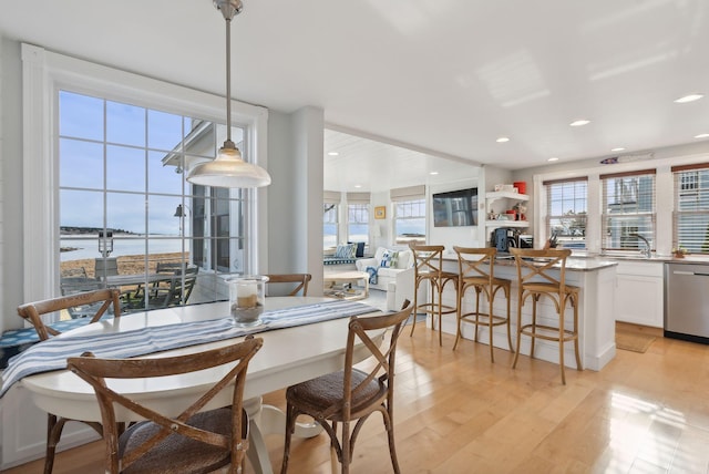 6 Brooks St, Kennebunkport, ME 04046 - dining room featuring plenty of natural light, light wood-style flooring, a water view, and recessed lighting