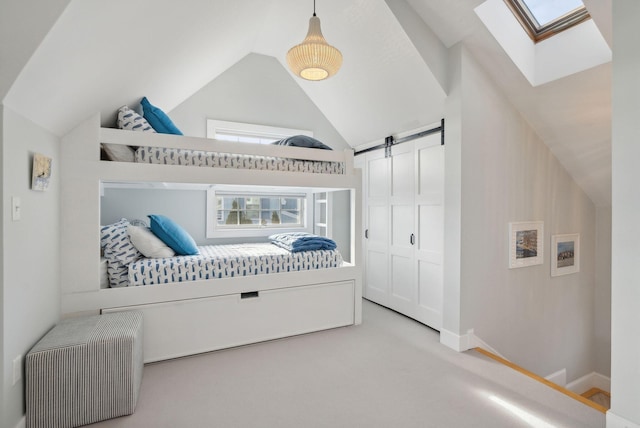 6 Brooks St, Kennebunkport, ME 04046 - carpeted bedroom featuring a skylight, lofted ceiling, a barn door, and a closet