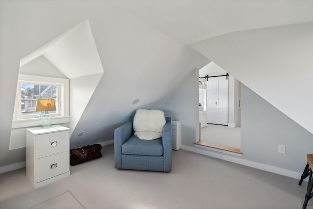 6 Brooks St, Kennebunkport, ME 04046 - living area featuring lofted ceiling, carpet floors, and a barn door