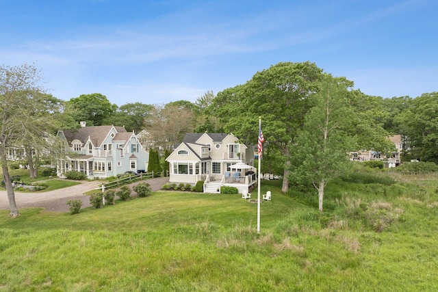 6 Brooks St, Kennebunkport, ME 04046 - shingle-style home featuring a porch, driveway, and a front lawn