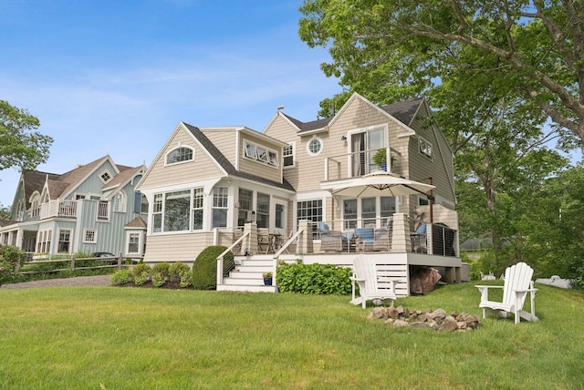 6 Brooks St, Kennebunkport, ME 04046 - back of house featuring a balcony, a yard, a sunroom, a wooden deck, and stairway