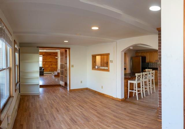 spare room featuring hardwood / wood-style floors and baseboard heating